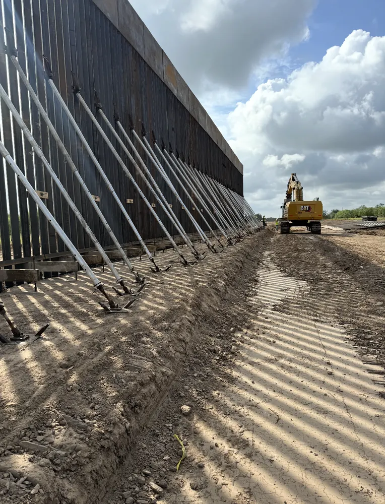 CMT technician performing nuclear density and concrete testing with mobile lab on the Texas border fence project in Del Rio, Eagle Pass, Rio Grande, and Quemado, Texas -- Citex CMT special inspections
